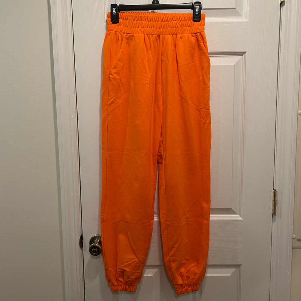 Bright orange sweatpants